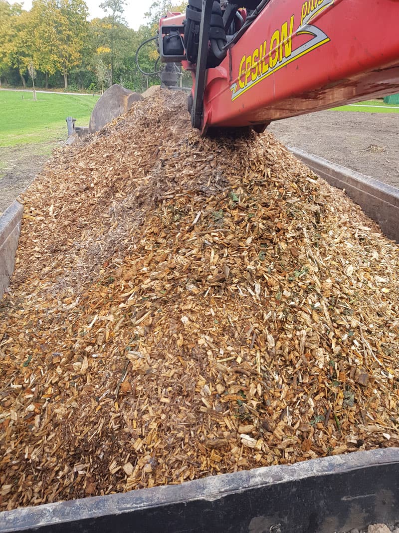 Removing wood chip from a job.